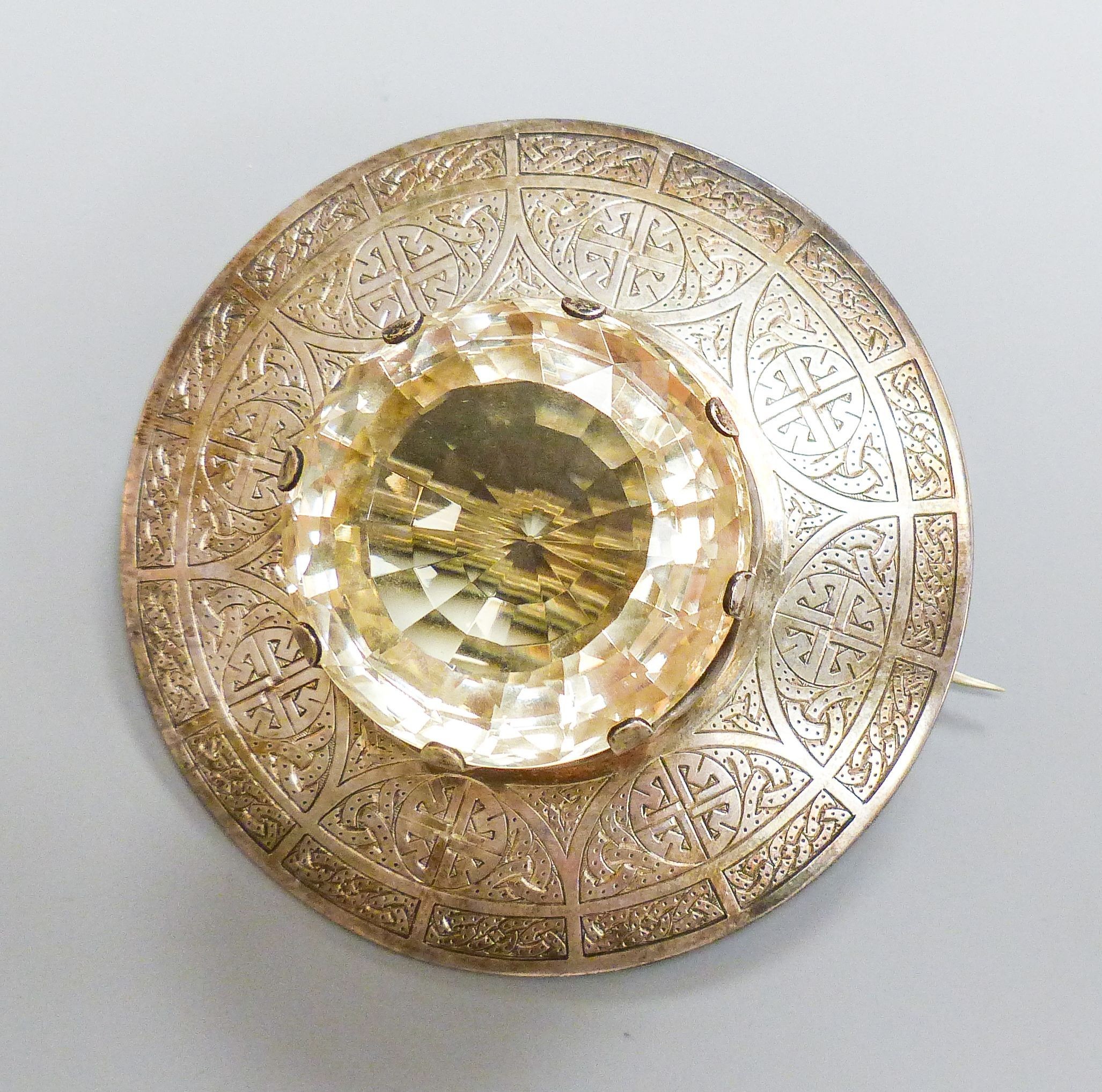 A late Victorian Scottish silver and large cairngorm set circular brooch, Robert & Henry Bruce Kirkwood, Edinburgh, 1892, diameter 81mm, gross weight 134.4 grams.